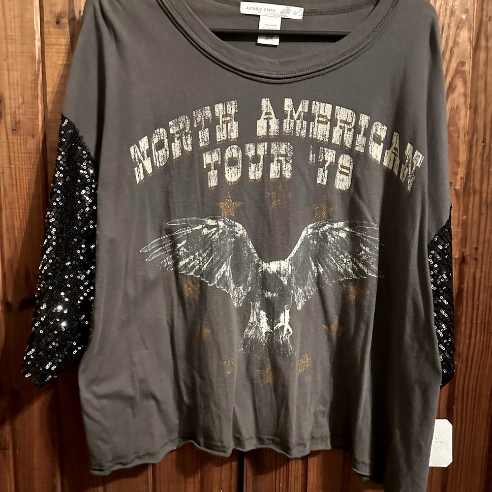 Altered State oversized t shirt with sparkle sleeves.